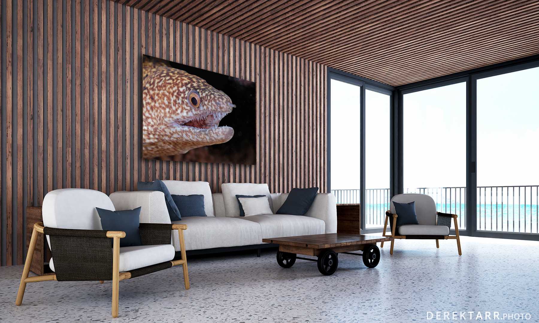 Ocean front living room with Stout Moray photo on wall